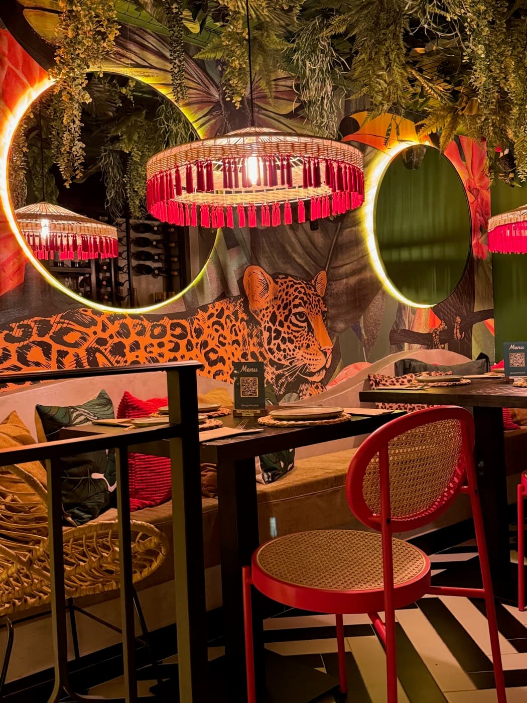 Leopard mural with circular ring lamps