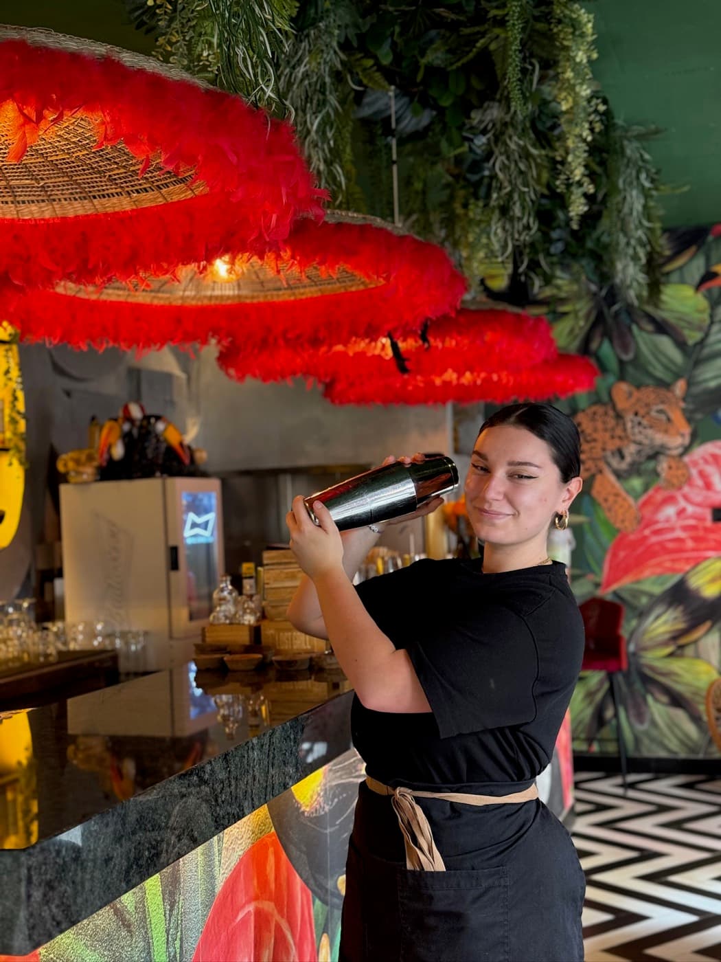 Bartender shaking a cocktail at the bar